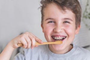 a boy brushing his teeth