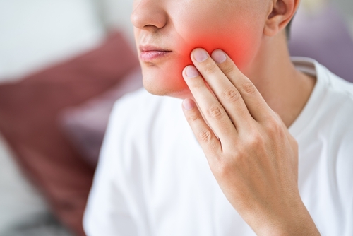 man with tooth pain