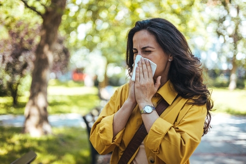 woman sneezing