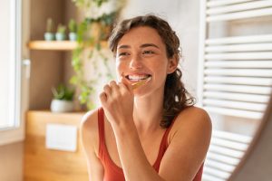 woman brushing her teeth