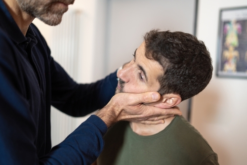 Close-up,Of,An,Osteopath,Performing,Cervical,Manipulation,And,Temporomandibular,Joint